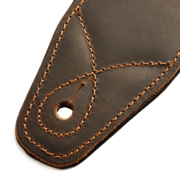 Closeup of a leather guitar strap made by ds custom guitars