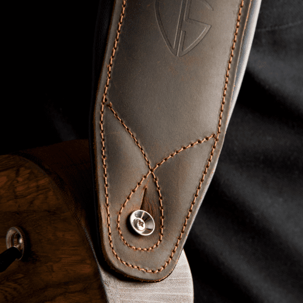 Closeup of a leather guitar strap made by ds custom guitars